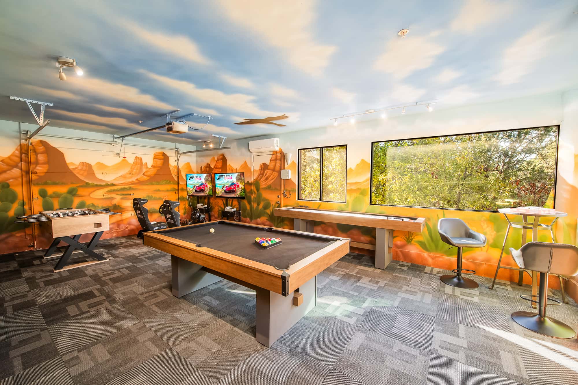 The game room with pool and foosball tables